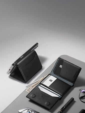 Image showing the Spigen Valentinus S card holder on desk mat with glasses , pen and car remote next to it