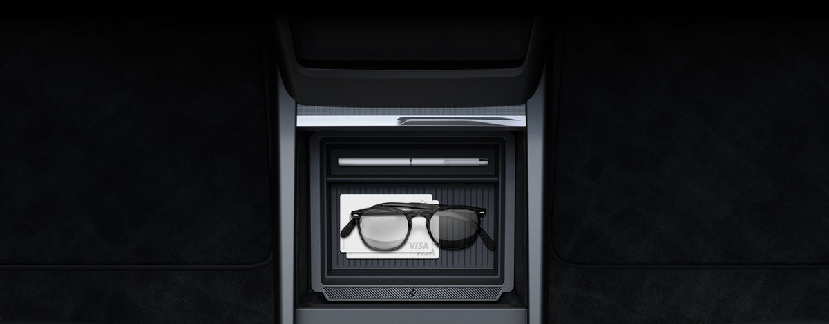 Showing the Spigen Organization Compartment with two visa cards, pen, and glasses in Tesla
