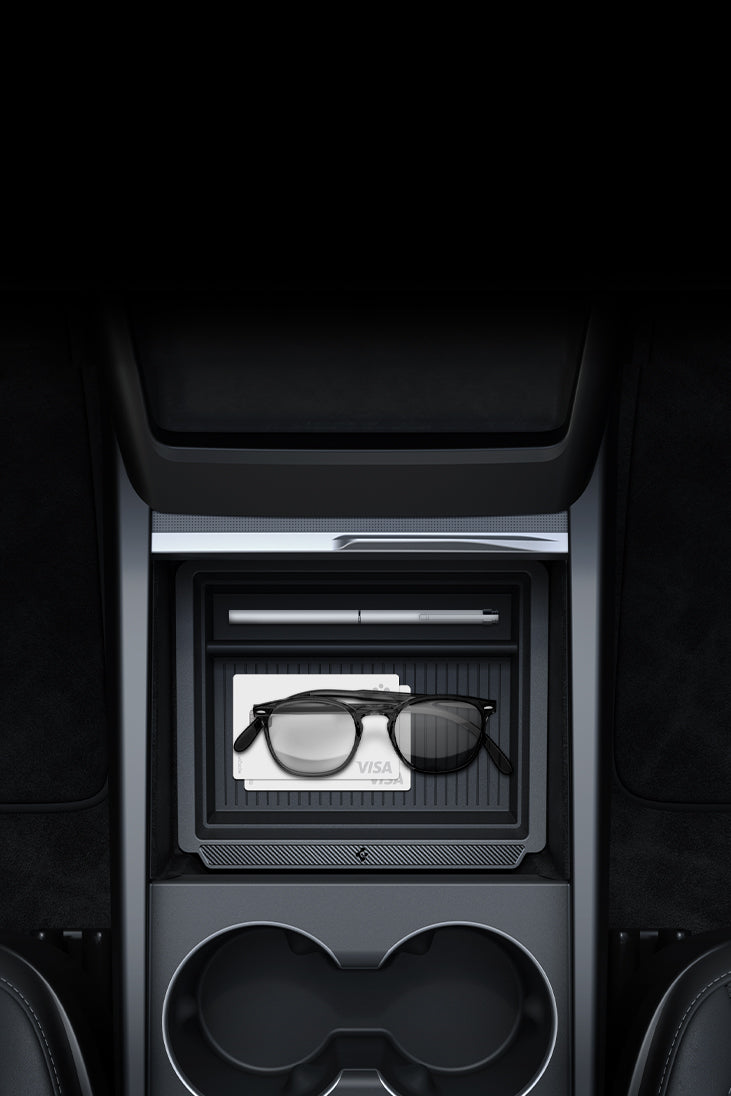 Showing the Spigen Organization Compartment with two visa cards, pen, and glasses in Tesla