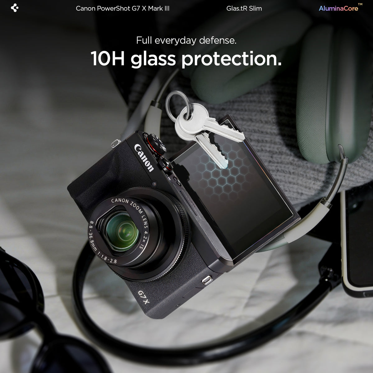 AGL11652 - PowerShot G7 X Mark III Glas.tR SLIM showing 10H glass protection feature with a lifestyle shot of Canon PowerShot G7 X Mark III and keys resting on the screen protector, demonstrating scratch resistance