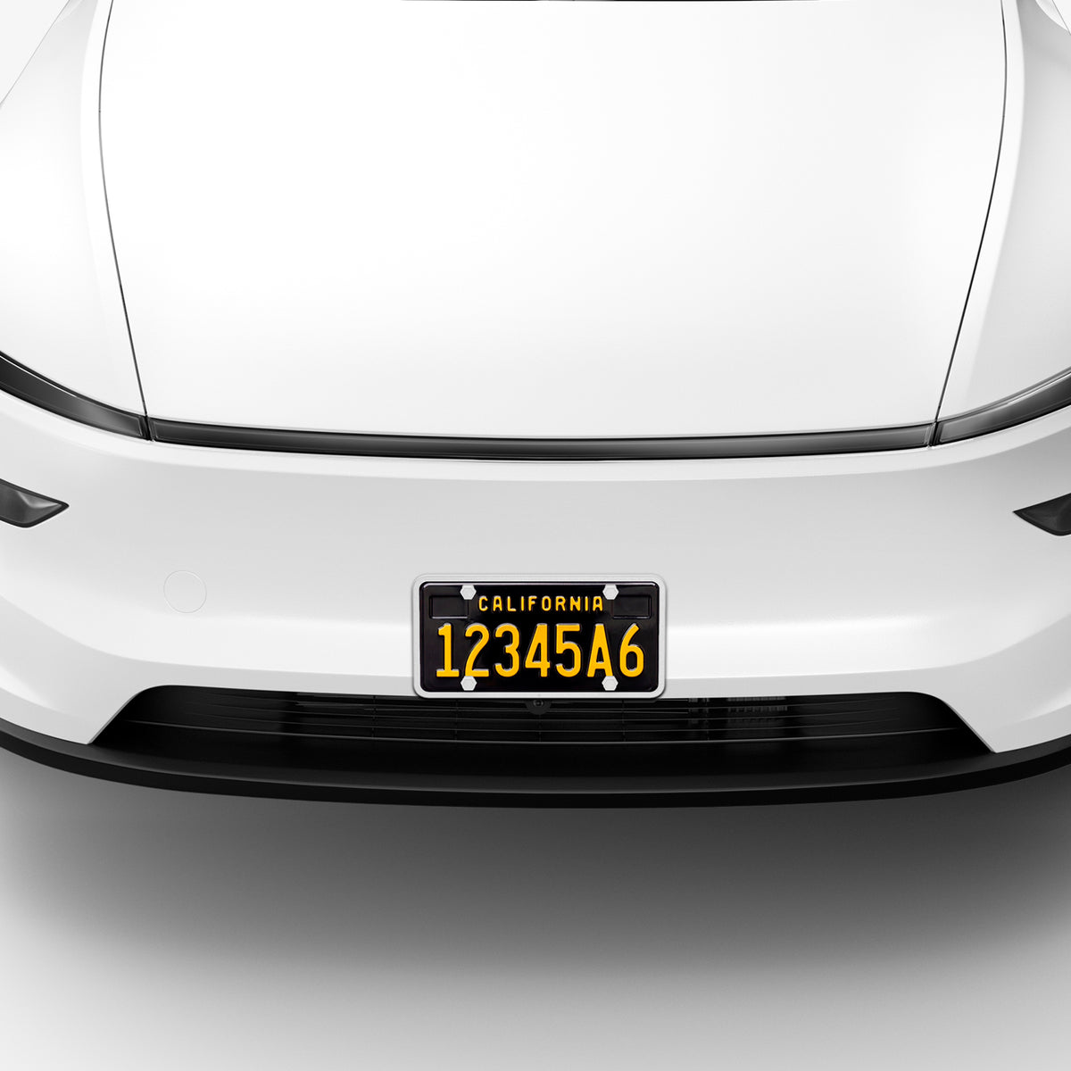 ACP12020 -  License Plate Frame | LP100 in White showing the front installed to the front of the car