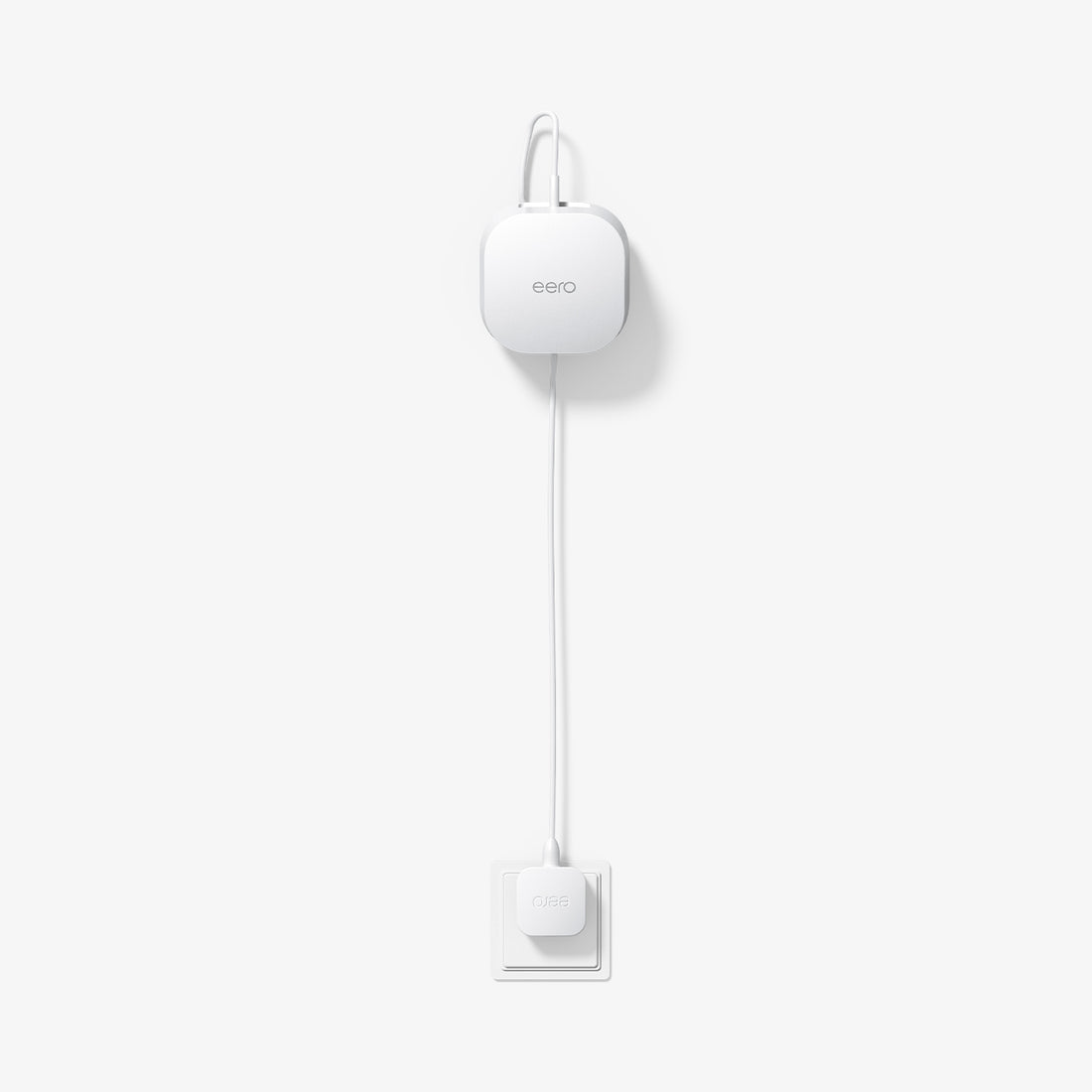 AMP09409 - Eero 6 Mount | ER110 in White showing the front and partial top installed and plugged in 
