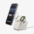 AMP09173 - Magsafe Duo Charger Stand (Mag Fit) in Dune Beige showing the phone and watch hovering in front of the MagSafe charger, partially detached from the charging stand.