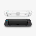 AGL10156 - Nintendo Switch 2 GLAS.tR EZ Fit in Clear showing the inner of the installation tray hovering above the device