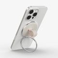 AMP09176 - O-Mag Magnetic Phone Holder (MagFit) OM104 in Dune Beige showing the back, top and side of the device, o-mag ring attached to the device showing it's partial side, ring propped up as a kickstand