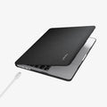 ACS05272 - MacBook Air Case Urban Fit in black showing the top and side with laptop slightly open and charging cable next to port