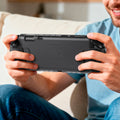 ACS10167 - Nintendo Switch 2 Ultra Hybrid case held in hands during handheld gaming on a couch