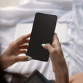 AGL09410 - Galaxy S25 Edge GLAS.tR EZ Fit Pro showing the a person holding the device with the screen protector installed
