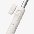 AMP09337 - Tripod Selfie Stick S541W in Dune Beige showing the detachable bluetooth remote hovering above the tripod stick