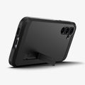 ACS06364 - Galaxy S23 FE Case Tough Armor in black showing the back and bottom with device propped up by built in kickstand