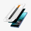 AGL09221 - Galaxy S25 Ultra GLAS.tR EZ Fit in Privacy showing the front of the alignment tray hovering above the screen protector and the device