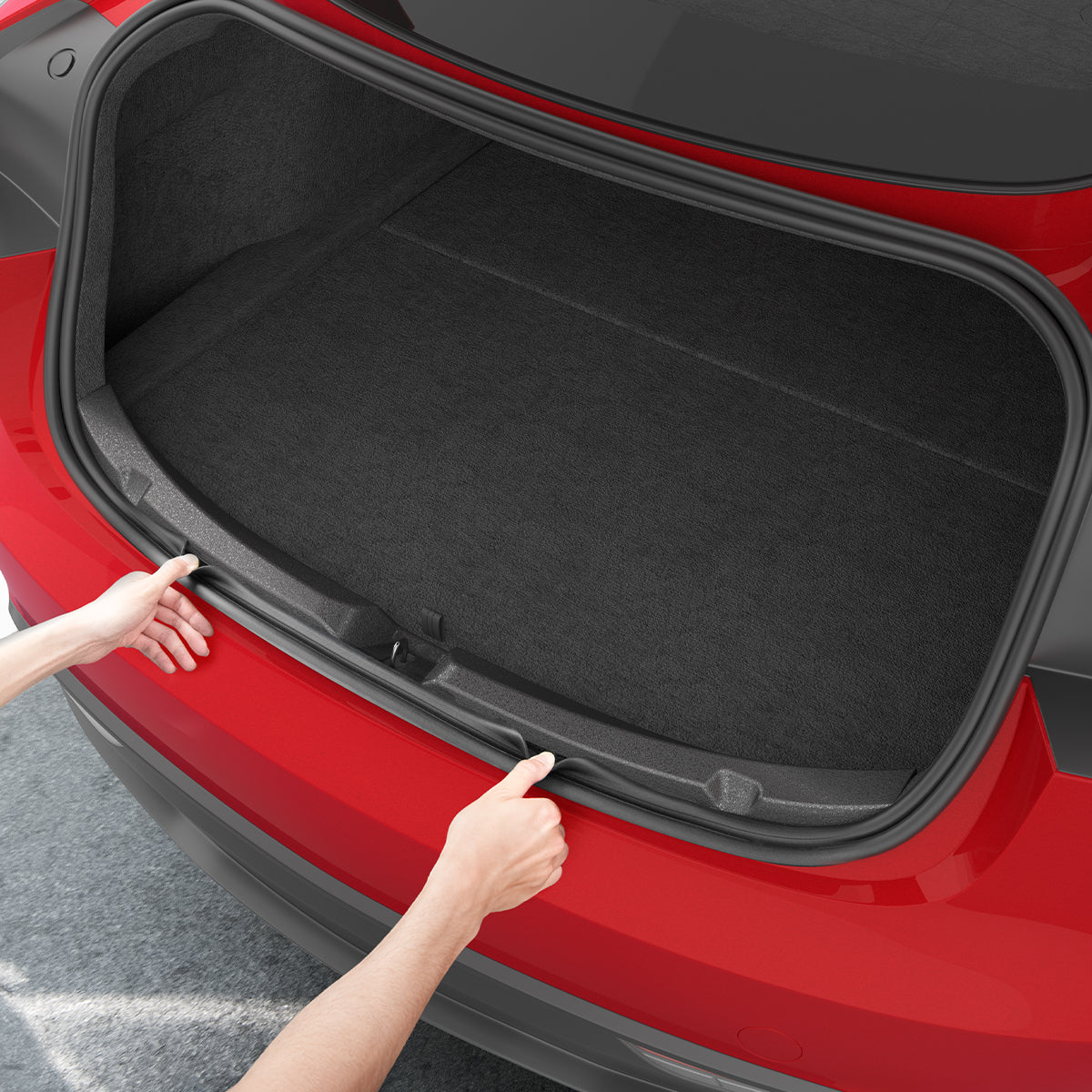 ACP11540 - Tesla Series Trunk Sill Guard Two hands pressing the Spigen bumper protector trim into both edges of an open Tesla trunk