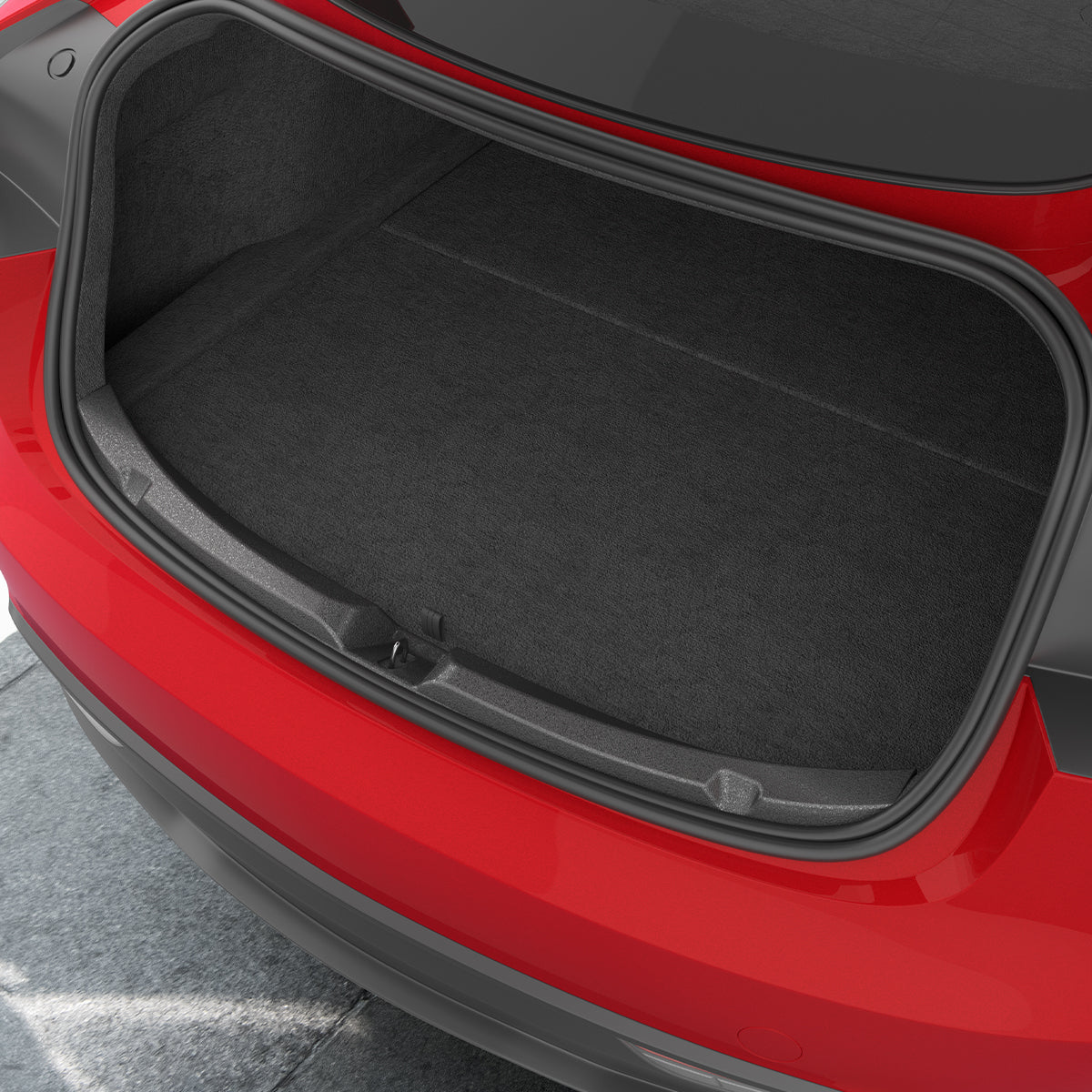 ACP11540 - Tesla Series Trunk Sill Guard Straight-on view of the black Spigen bumper scuff plate installed along a red Tesla's trunk edge