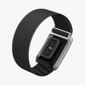 AMP10187 - WHOOP 5.0 fabric band black angled rear view showing integrated sensor module adjustable woven fabric strap and metal clasp