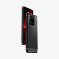 ACS07502 - Xiaomi 13T Pro Rugged Armor Case in Matte Black showing the back, partial side, hovering behind, a device showing partial front and side