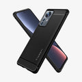 ACS05299 - Xiaomi 12T Pro Rugged Armor Case in Matte Black showing the back, partial side, behind, a device showing partial front and partial side