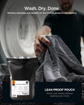 ACP11389 - Man pulling a Spigen microfiber towel out of a dryer, shown next to the packaging with a note that it's machine washable and dryable