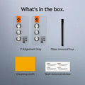 AGL07444 - Galaxy S24 Optik Pro EZ Fit Lens Protector in Yellow showing what's in the box. 2 Alignment trays, Glass removal tool, Cleaning cloth and Dust removal sticker