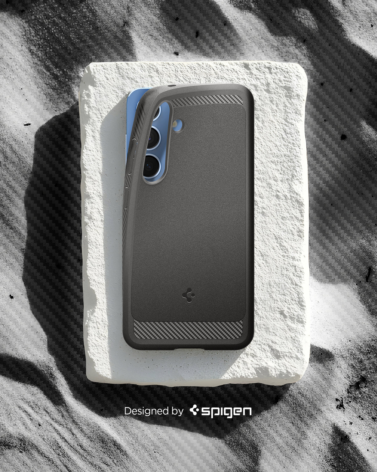 ACS08999 - Galaxy S25 Case Rugged Armor (MagFit) in Marble Gray designed by spigen. Showing the phone with the pattern on the sand. 