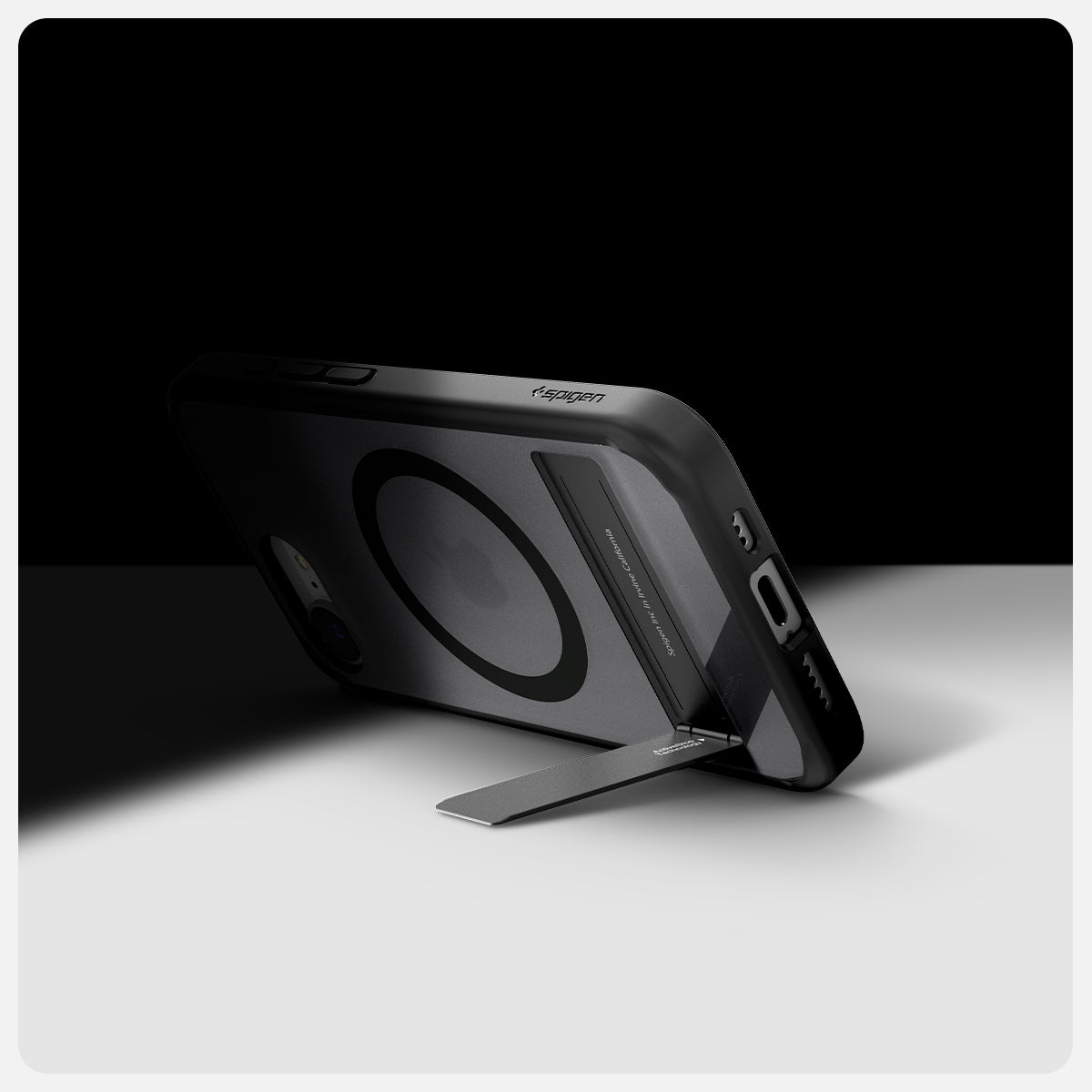 ACS09149 - iPhone 16e Case Ultra Hybrid S (MagFit) in Frost Black showing the back, partial side and bottom, propped up with the built-in kickstand