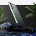 ACS05708 - Galaxy S23 Case Liquid Crystal in crystal clear showing back over the water.