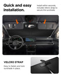 ACP11459 - Universal CryoShade UO260 S showing sunshade tucked behind sun visors inside car cabin with velcro strap detail and installation steps below