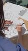 girl drawing designs showing how Spigen products are designed.