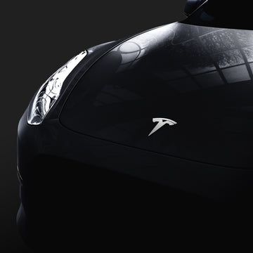 Showing the front of Tesla hood with the Tesla logo standing out